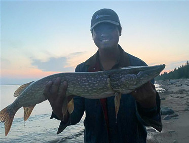 Christian holding a large pike