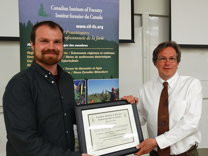 gord stenhouse (right) recieving the tree of life award from the canadian institute of forestry