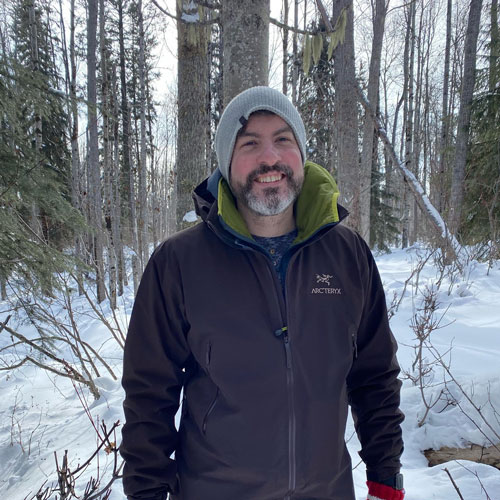 dr ian best in a snowy forest