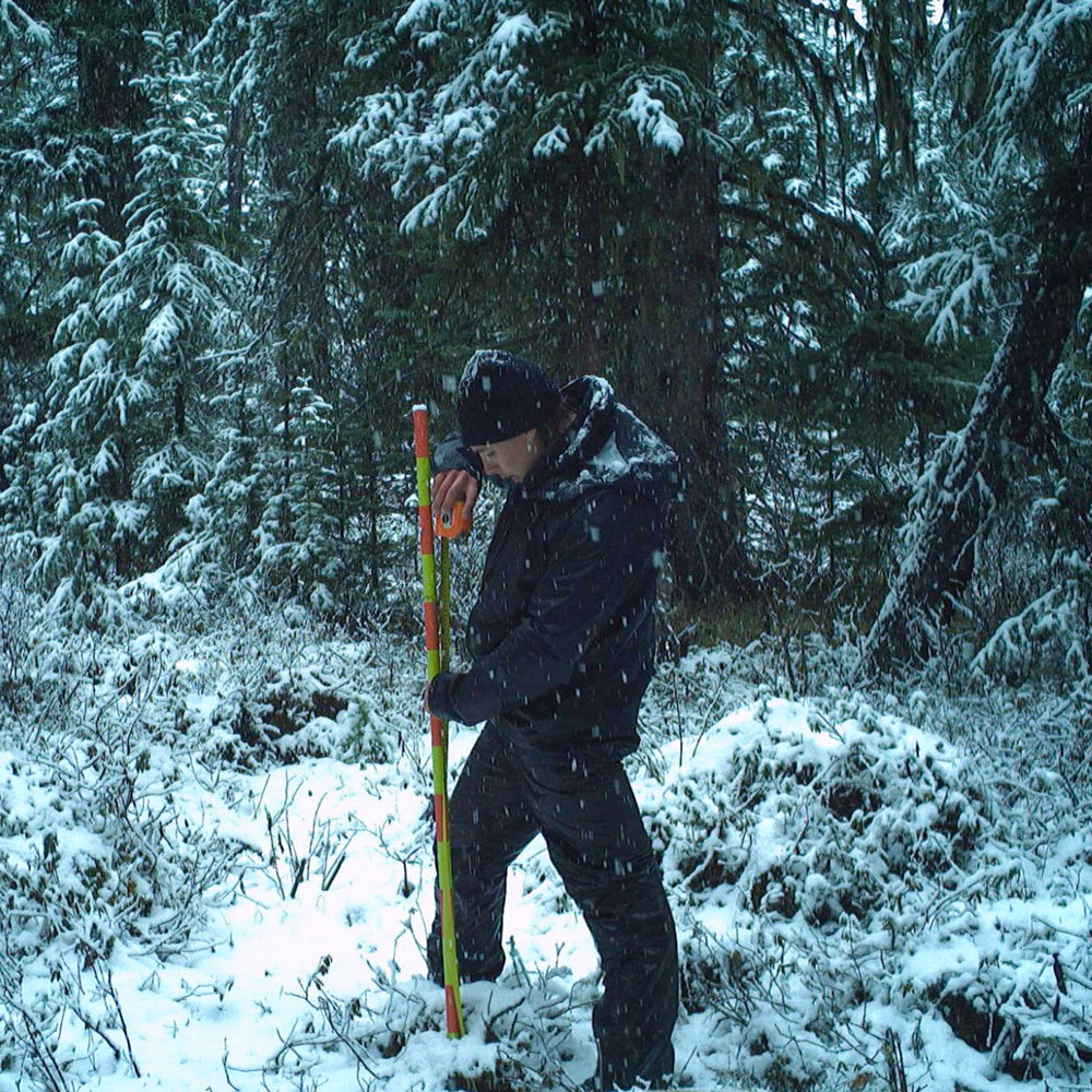 Austin verifying that no one snuck out and repainted the 10cm stripes on the poles.