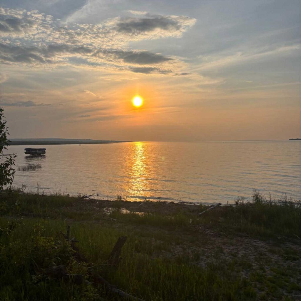 the sun rises over lesser slave lake photo: javier puac